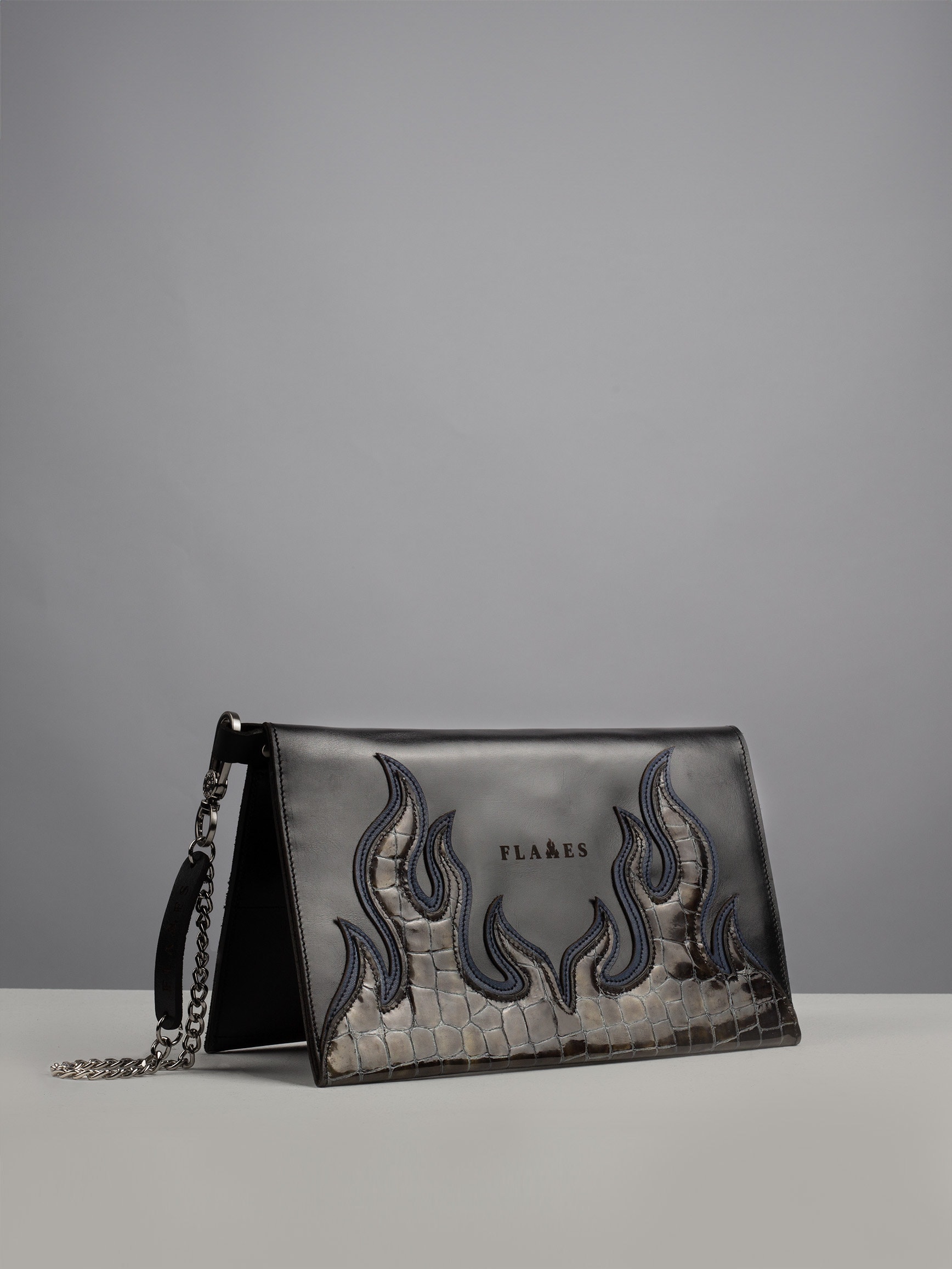 Handcrafted Dark Snake Flame Clutch: Luxury Leather Elegance