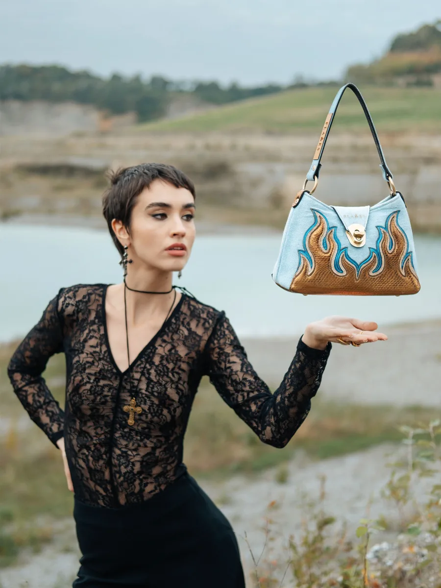 The Holy Flame handcrafted leather handbag with light washed denim combined with Flames