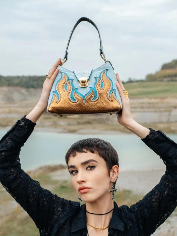 The Holy Flame handcrafted leather handbag with light washed denim combined with Flames